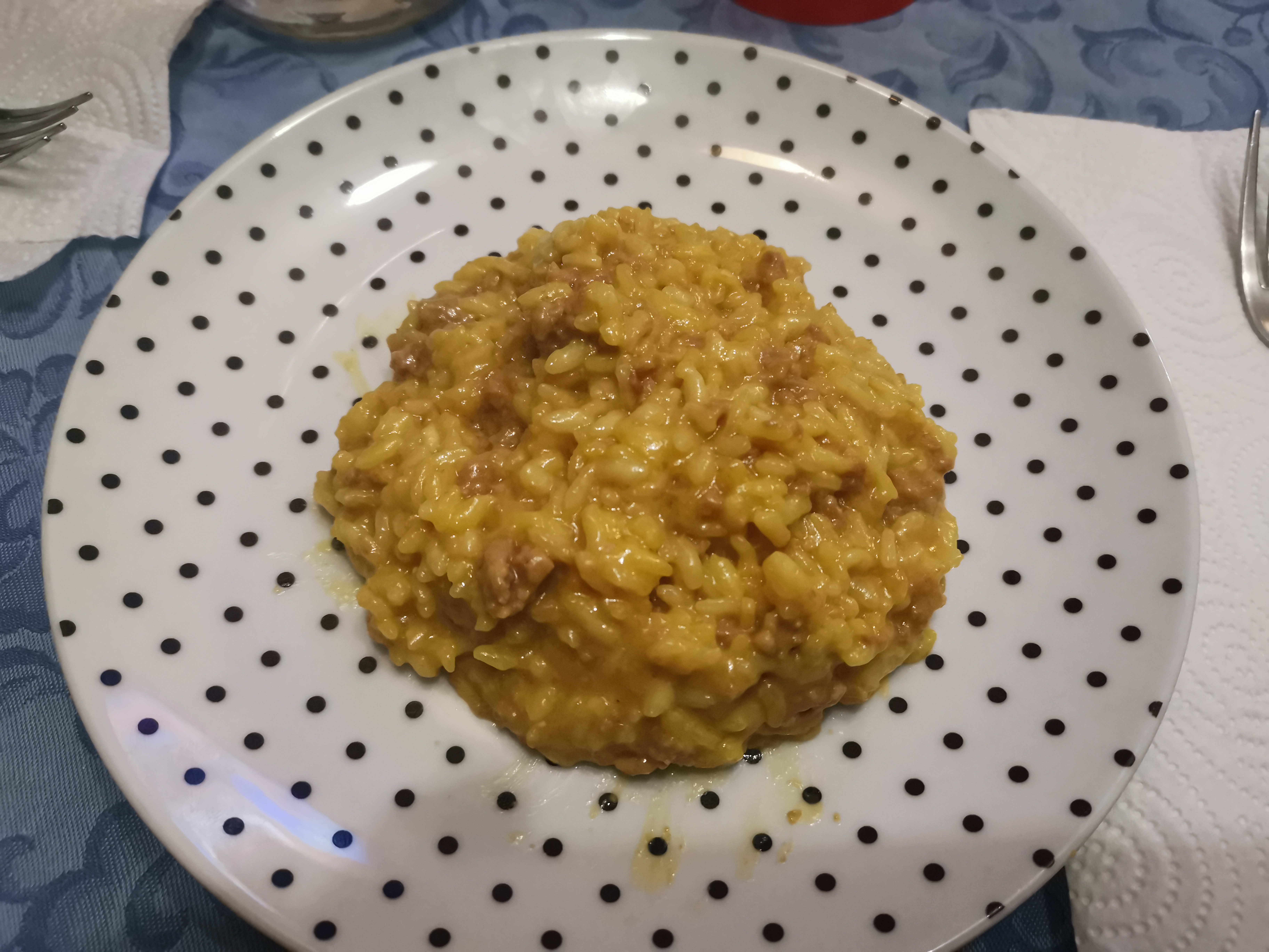 Risotto con carne di suino e delicatissimo zafferano