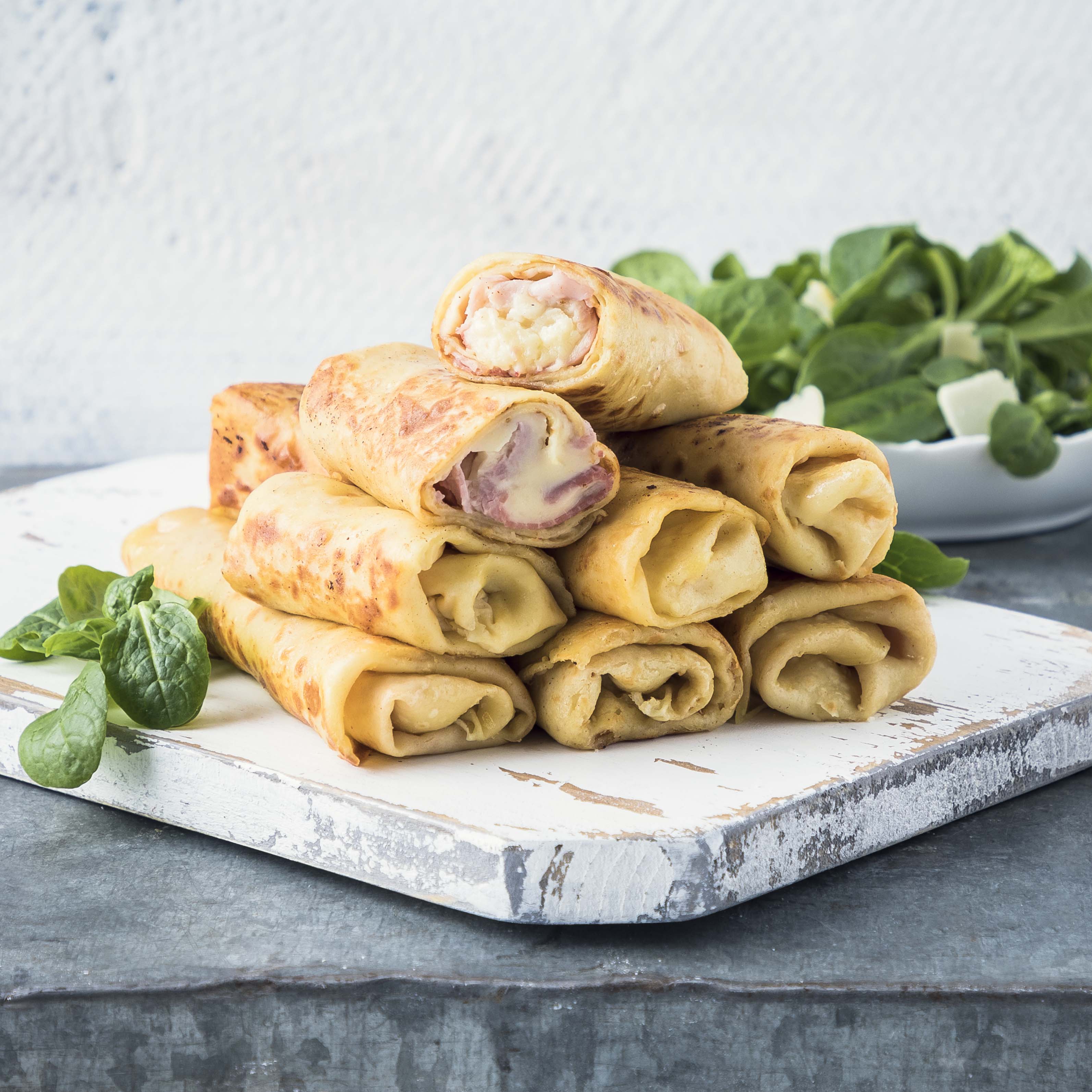 Crepe con prosciutto e besciamella al parmigiano