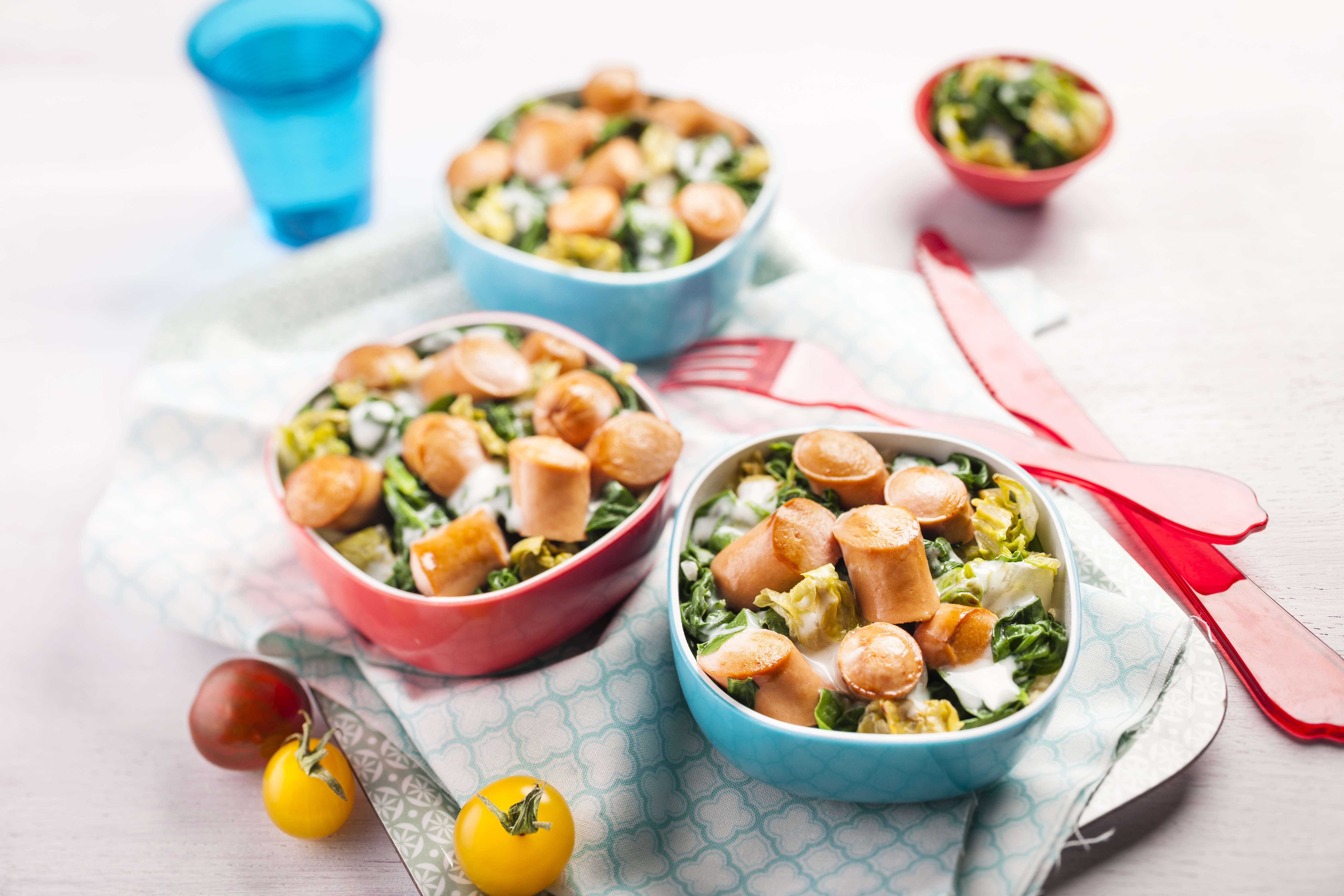 Spinaci con panna e wurstel