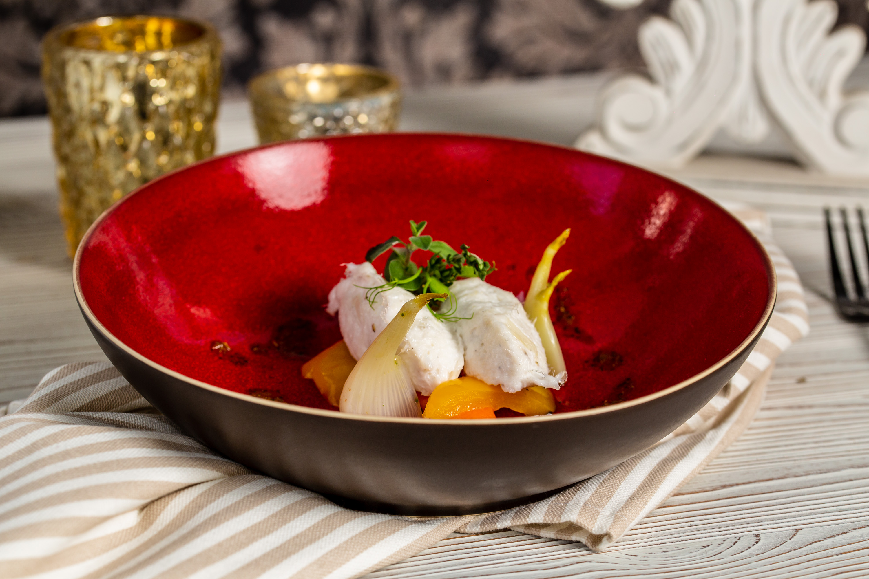 Quenelle di baccalà con giardiniera d'inverno, intingolo di pomodori essiccati, semi di finocchio e olio verde