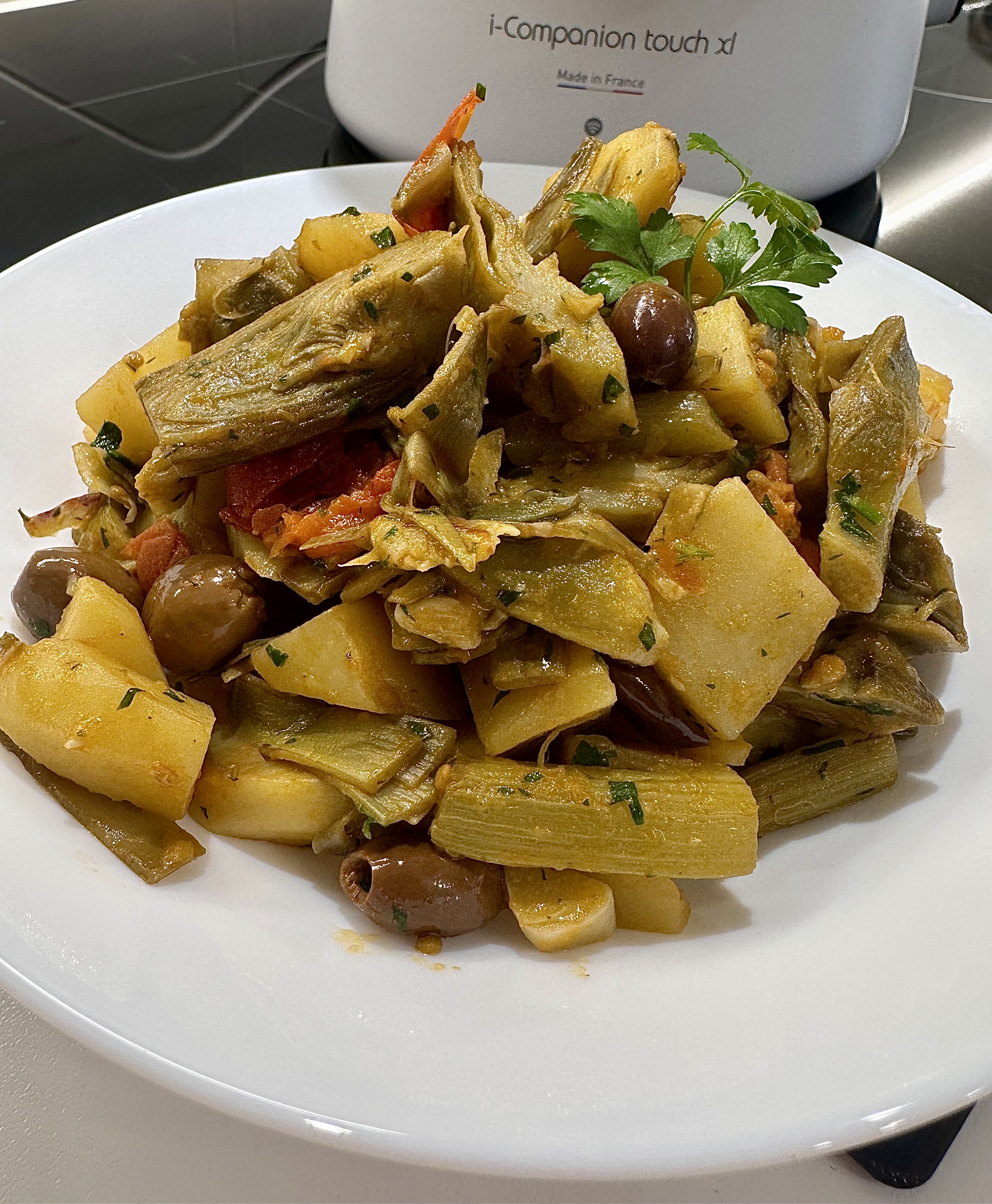 Carciofi patate pomodori e olive